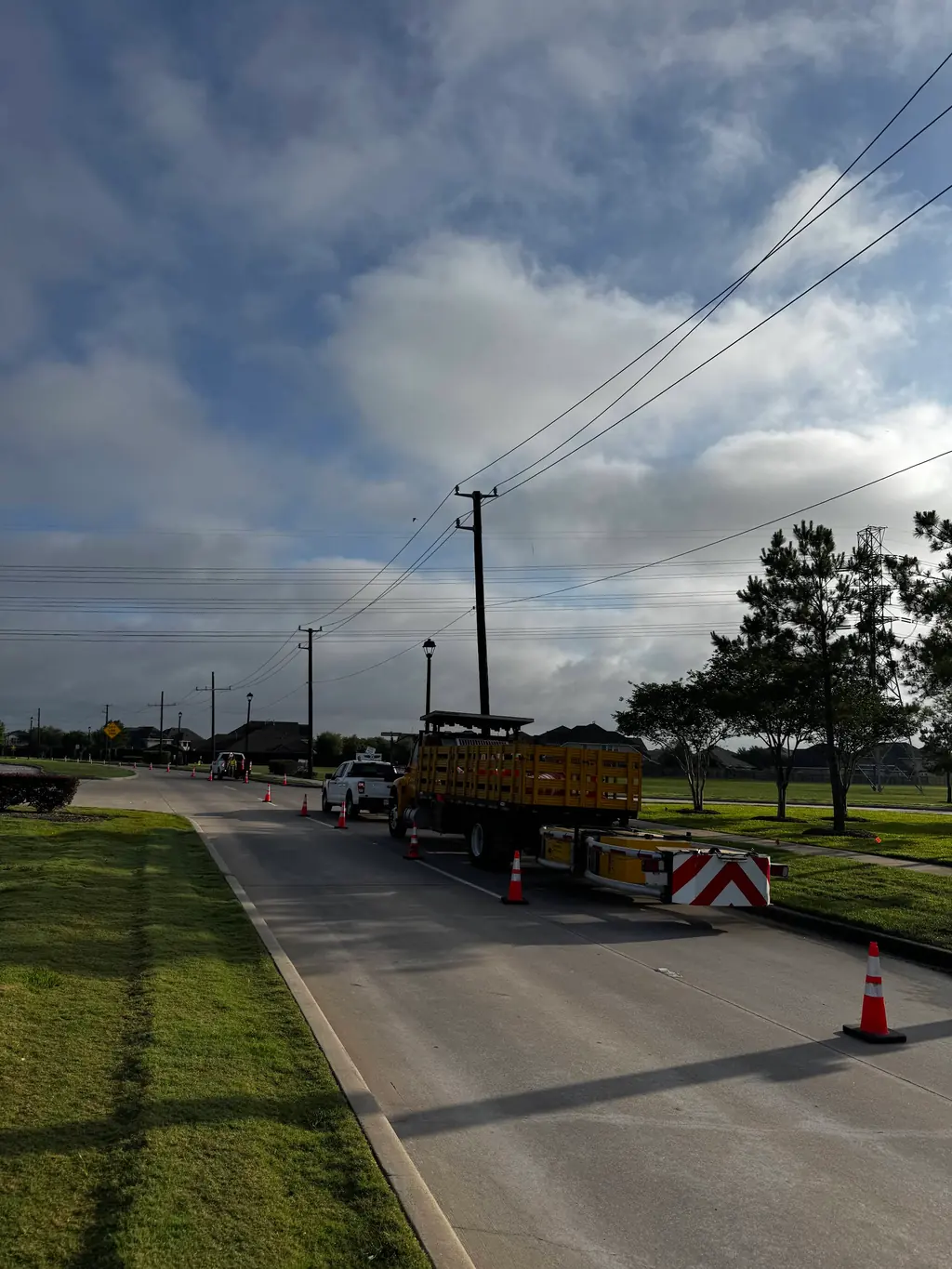 TMA truck and cones along a residential street work zone.